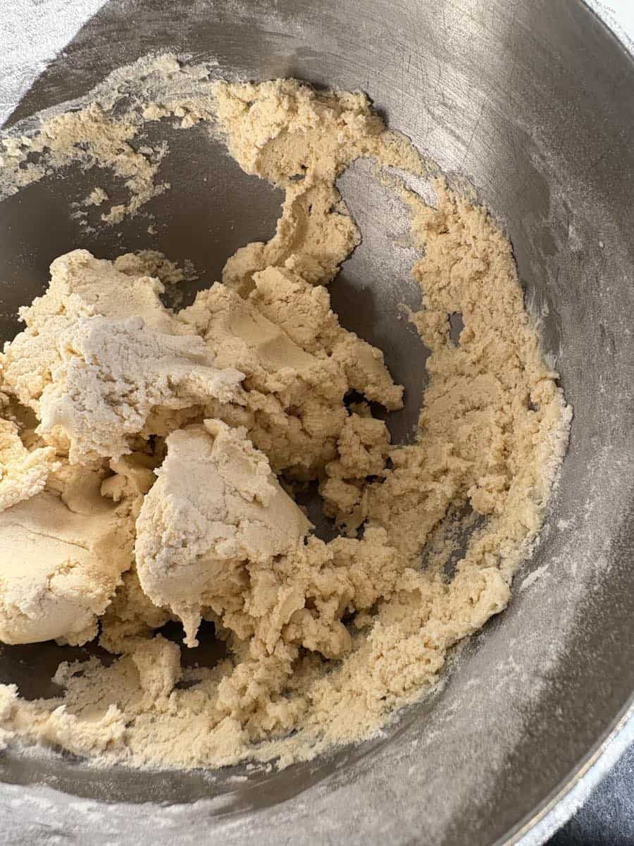 A silver mixing bowl of shortbread dough.