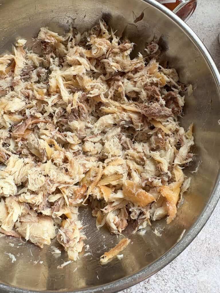 Flaked Mackerel Fillets in a silver bowl.