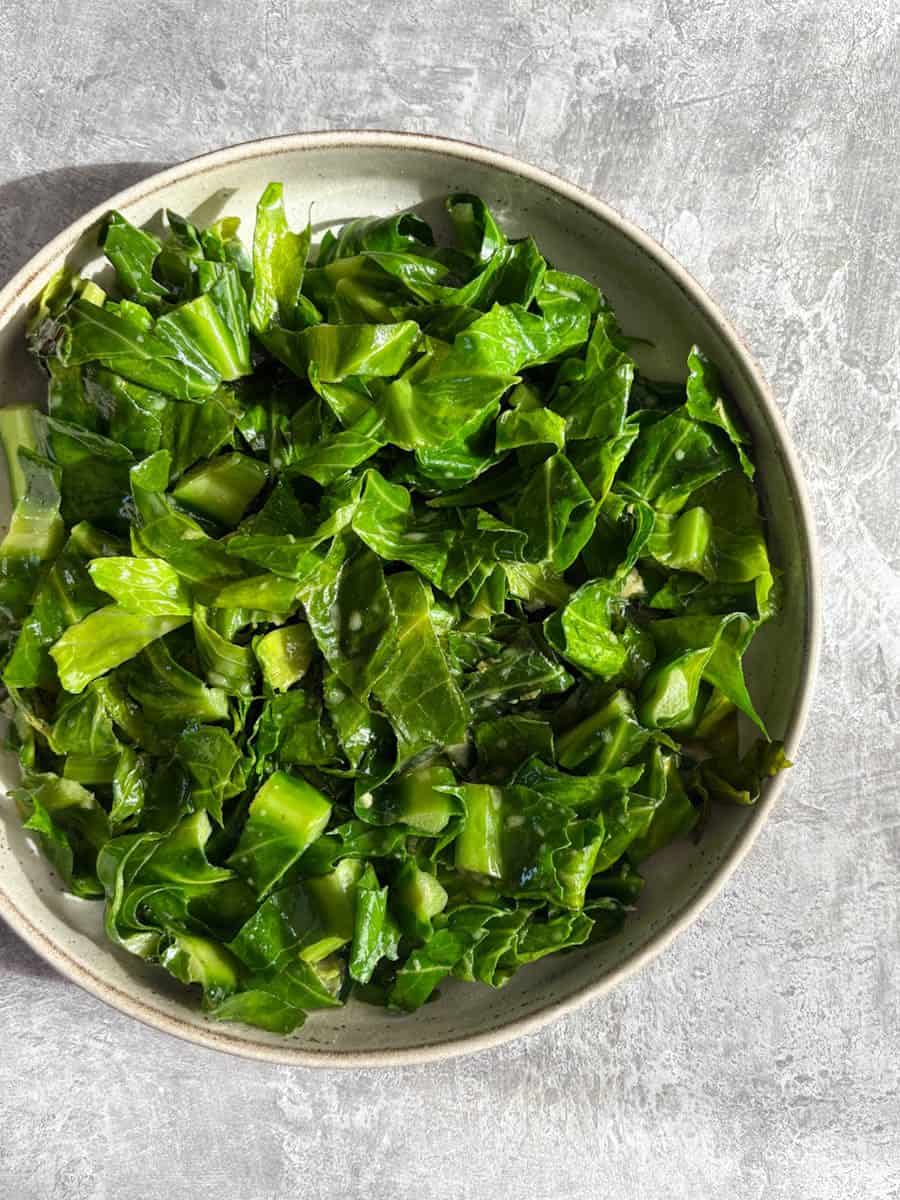 A bowl of sliced Spring greens.